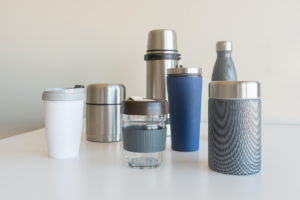 A collection of reusable mugs and bottles.